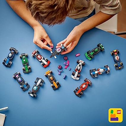 LEGO F1 Collectible Race Cars Toys - Get 1 of 12 Mini Car Models with Drivers Helmets & Moving Wheels - Formula 1 Teams incl. Ferrari, Mercedes, McLaren, Red Bull - Mystery Box - 71049
